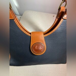 Dooney & Bourke All Weather Leather Crescent Hand Bag